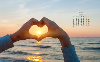 2016年2月日历精选手中的夕阳桌面壁纸图片下载